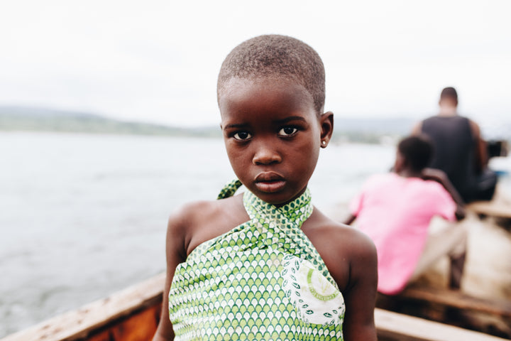 Stock Image of girl on Ghana's Lake Volta which is a hotspot for child trafficking and forced labour slavery. IJM Ghana works to combat forced labour slavery.
